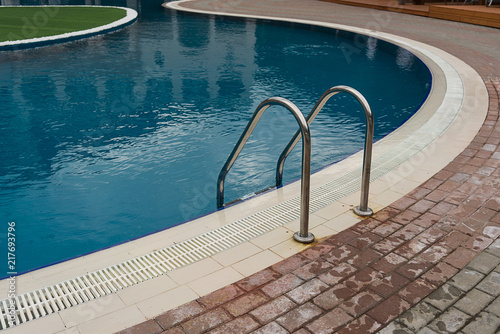 stainless steel ladder and swimming pool