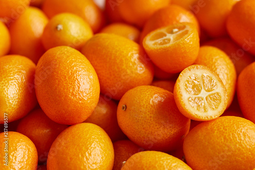 Bunch of fresh kumquats in the organic food market photo