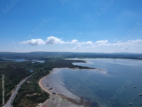 Road through seaside landscape as seen by a drone