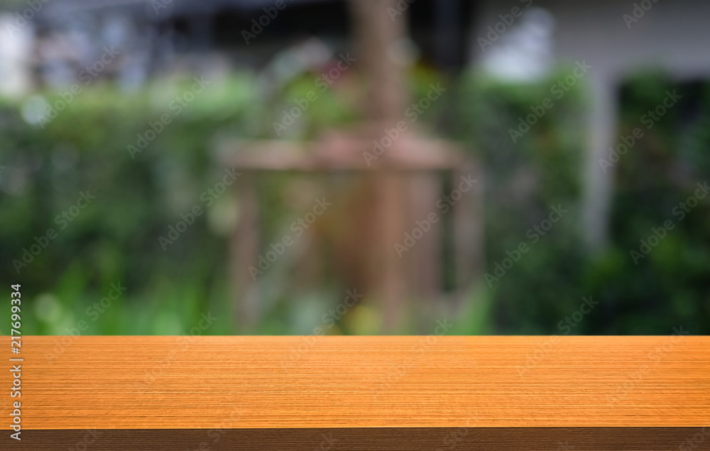 Empty dark wooden table in front of abstract blurred bokeh background of restaurant . can be used for display or montage your products.Mock up for space. Empty dark wooden table in front of abstract blurred bokeh background of restaurant . can be used for display or montage your products.Mock up for space.