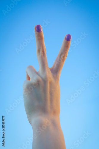 Silhouette of the victory of gesture of hand photo