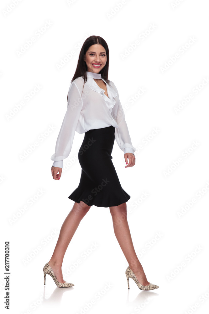 side view of sexy businesswoman in black skirt stepping side view of sexy businesswoman in black skirt stepping