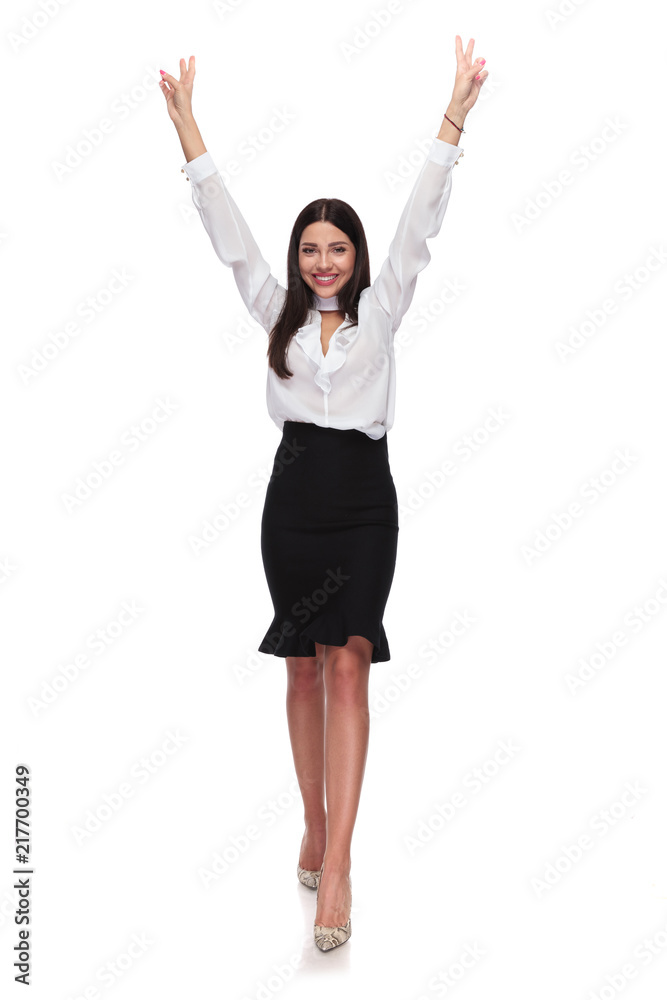 businesswoman stepping forward and celebrating with hands in the air businesswoman stepping forward and celebrating with hands in the air