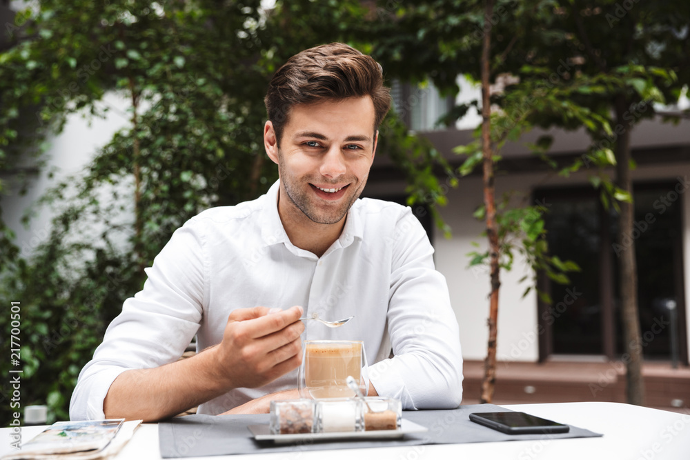 Smilig young businessman dressed in shirt Smilig young businessman dressed in shirt