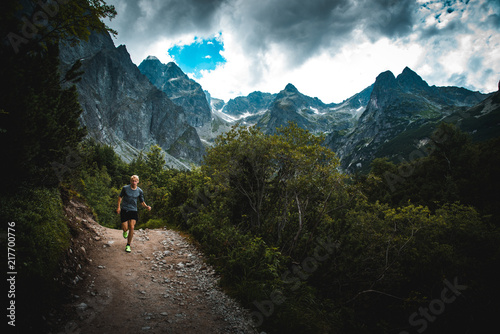 Runner run on Trail in mountains - trail running concept sport photo, edit space