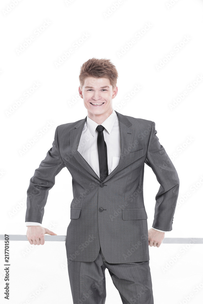 young businessman drawing on white wall.isolated on a white young businessman drawing on white wall.isolated on a white
