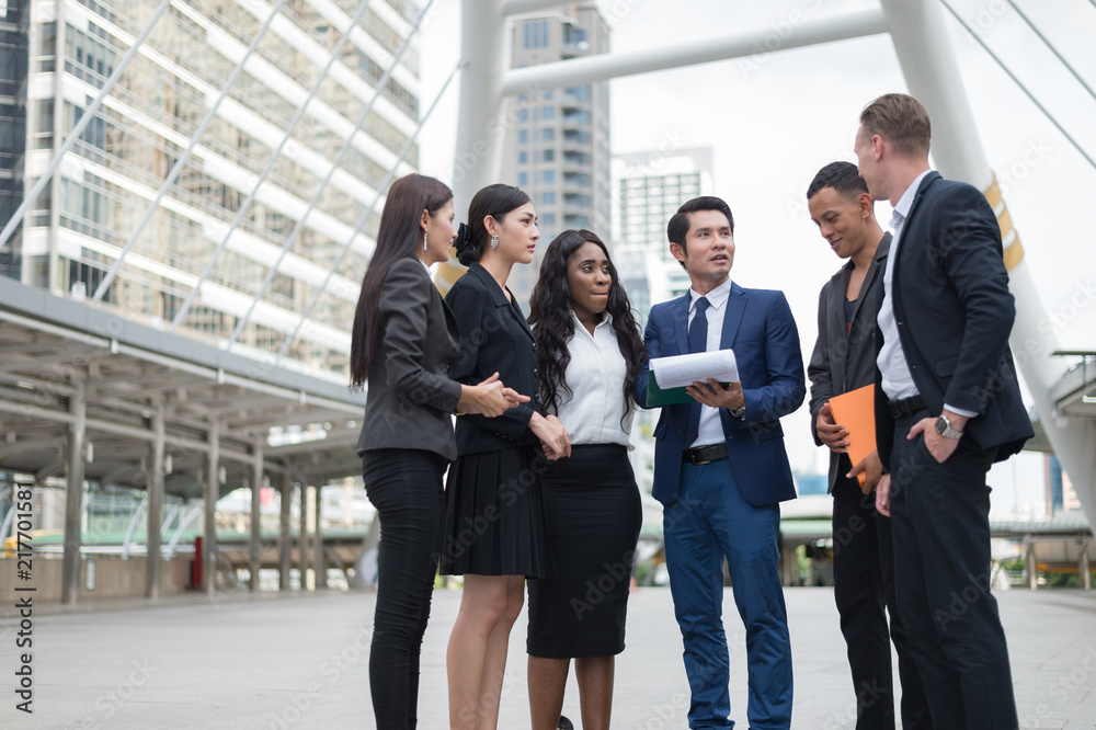 Group of business people standing in the city and discussing ideas for business future. multi culture of business people, African, Caucasian and Asian. Group of business people standing in the city and discussing ideas for business future. multi culture of business people, African, Caucasian and Asian.