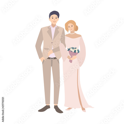 Pair of bride and groom standing together