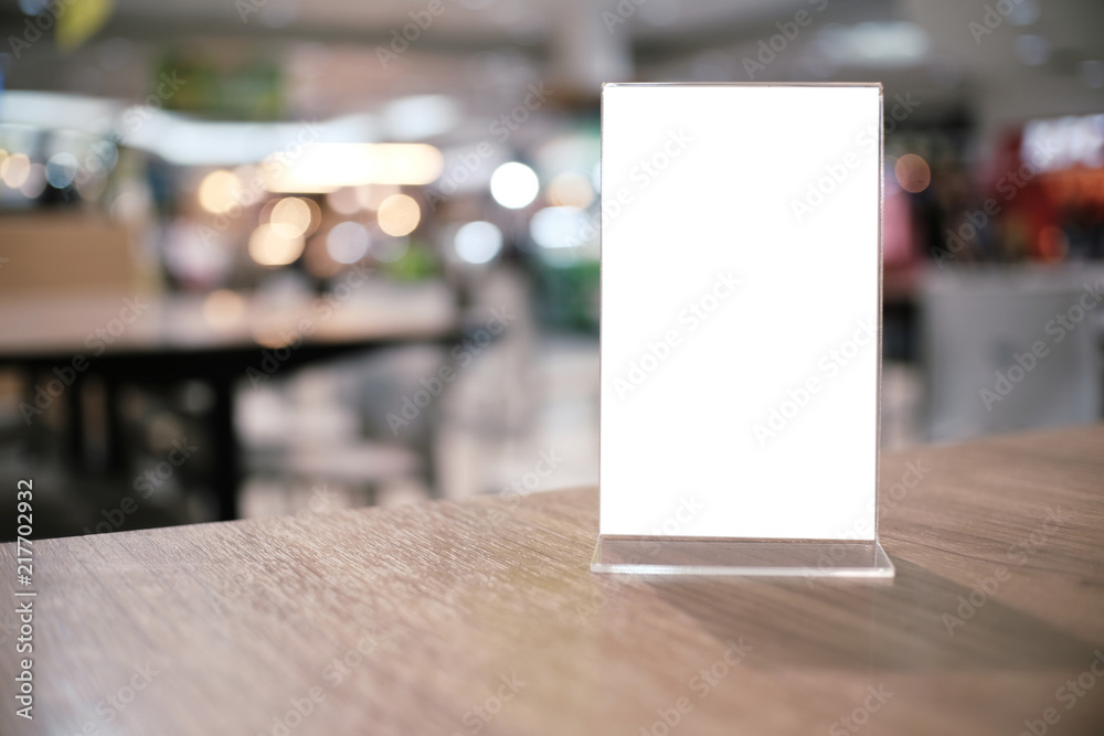 Menu frame standing on wood table in Bar restaurant cafe. space for text marketing promotion.