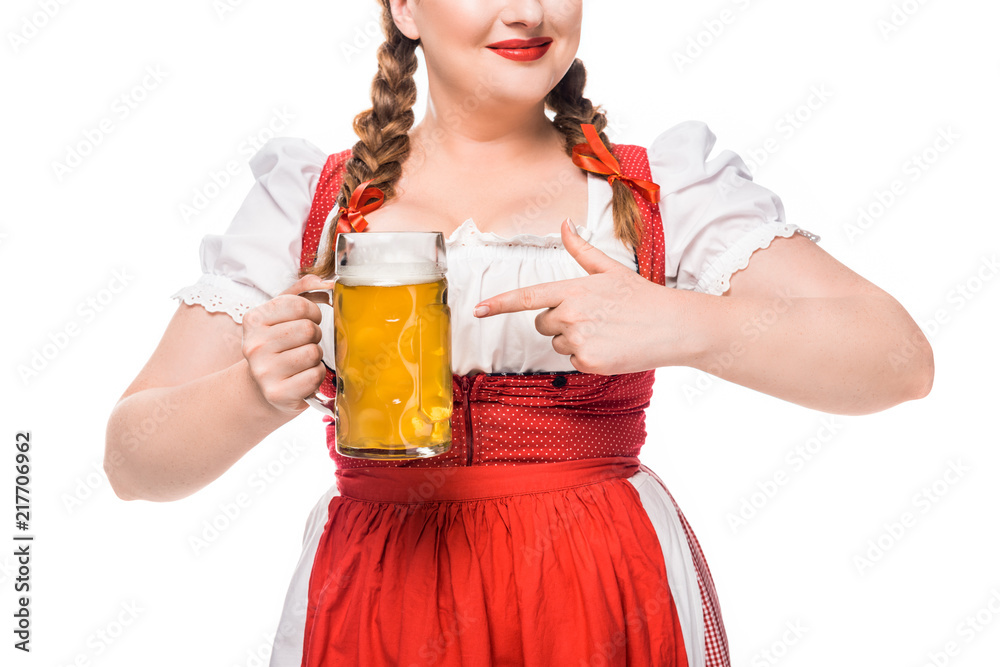 partial view of oktoberfest waitress in traditional bavarian dress pointing by finger on mug of light beer isolated on white background partial view of oktoberfest waitress in traditional bavarian dress pointing by finger on mug of light beer isolated on white background
