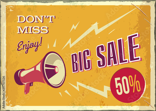 Vector vintage megaphone. Big sale poster with grunge texture. Retro megaphone on the orange background with place for text.