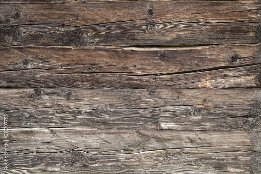 closeup of very old brown wooden weathered planks of door or barn closeup of very old brown wooden weathered planks of door or barn