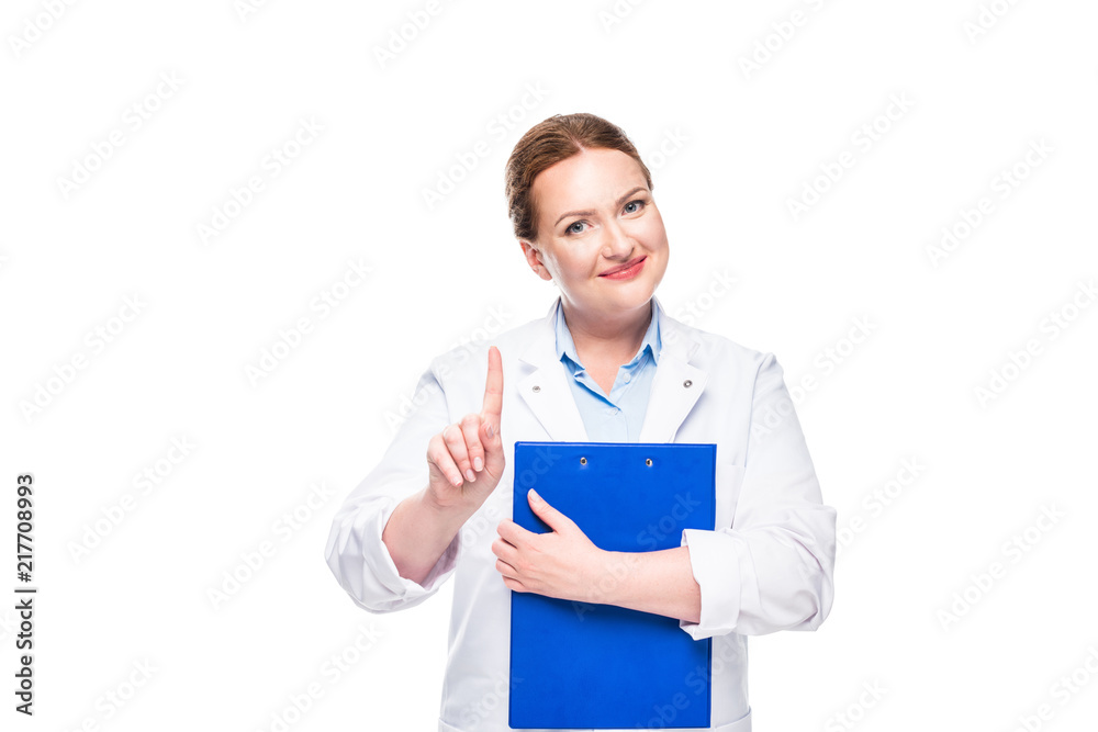 smiling female doctor holding clipboard and doing idea gesture isolated on white background smiling female doctor holding clipboard and doing idea gesture isolated on white background