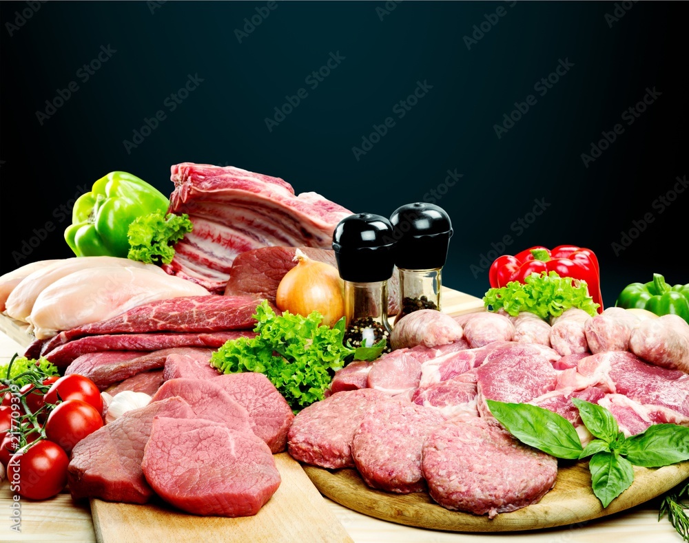 Fresh Raw Meat Background with vegetables Fresh Raw Meat Background with vegetables