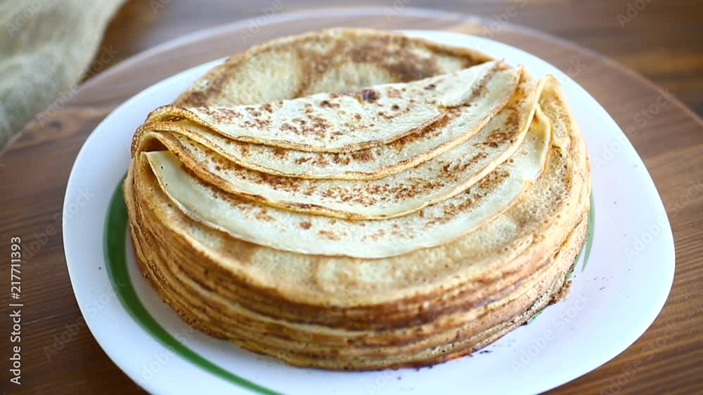 big high stack of thin pancakes in a plate big high stack of thin pancakes in a plate