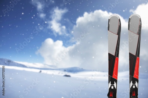 Pair of Black Skis on winter background