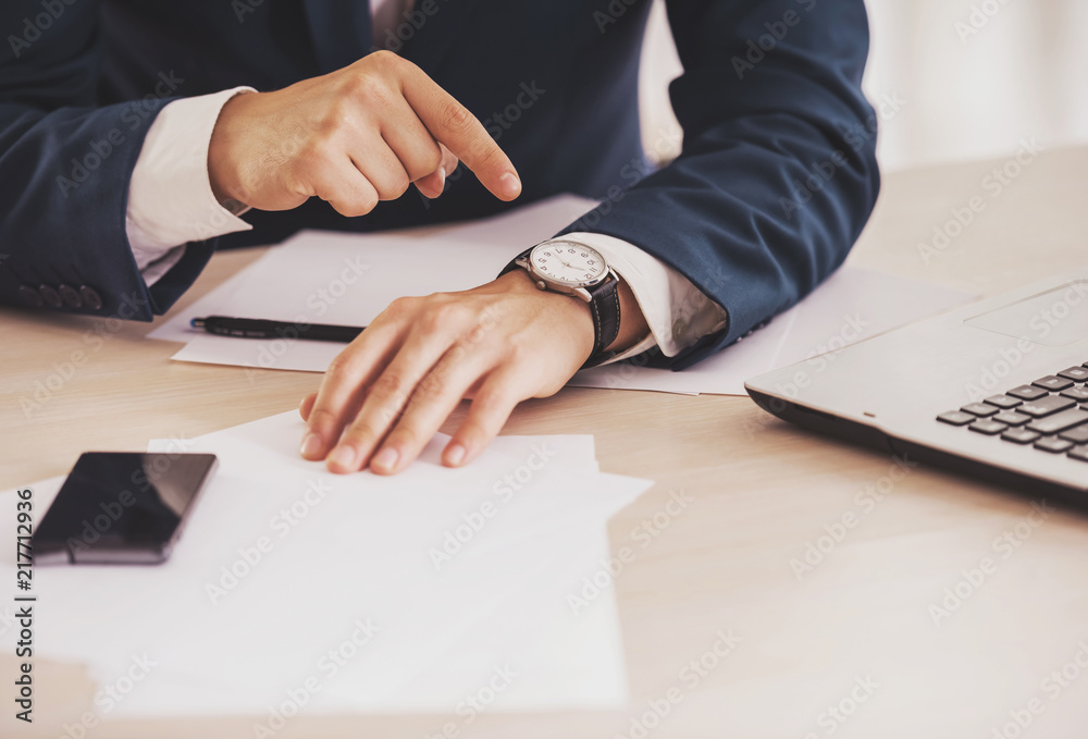 Obraz premium Close up. Hand of Businessman Pointing on Watch.