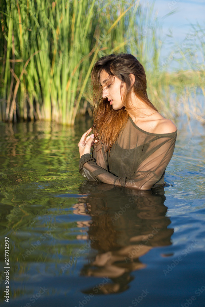 summer portrait of a swimming girl, emotional portrait of a girl in the water summer portrait of a swimming girl, emotional portrait of a girl in the water