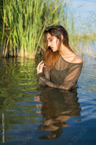 summer portrait of a swimming girl, emotional portrait of a girl in the water