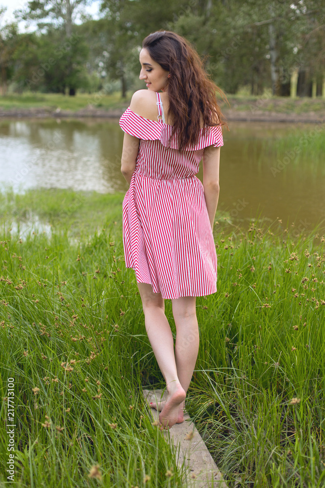 Portrait of a beautiful girl in the summer in the forest Portrait of a beautiful girl in the summer in the forest