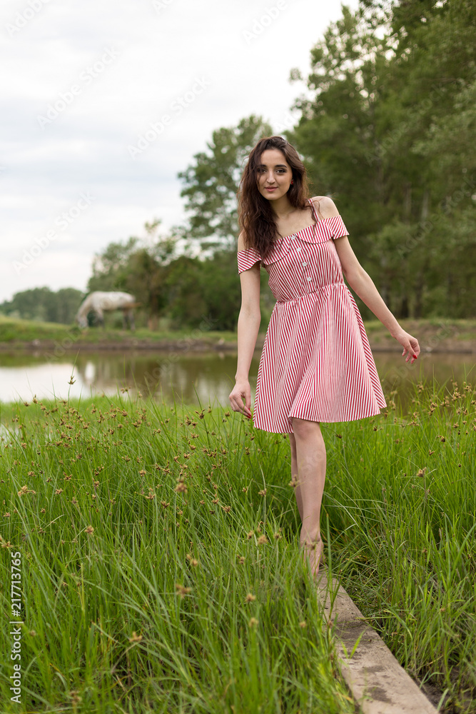 Portrait of a beautiful girl in the summer in the forest	