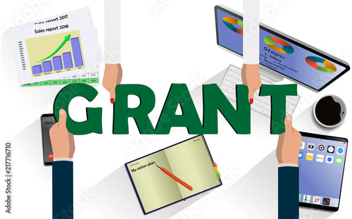 Top view on hands with letters GRANT above desk with laptop,mobile, tablet and other business accessories Modern business workplace