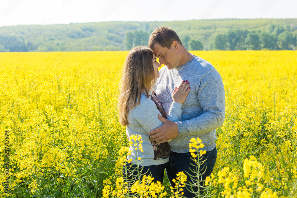Beautiful couple in love in the field