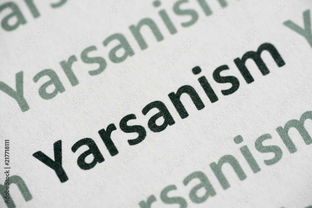 word Yarsanism printed on paper macro word Yarsanism printed on paper macro