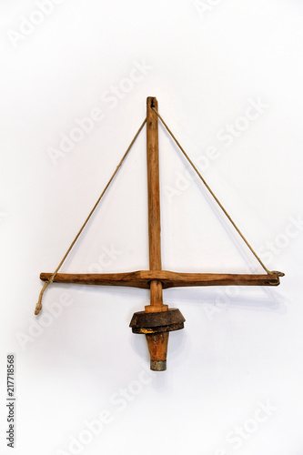 Old wooden hand drill on a white background