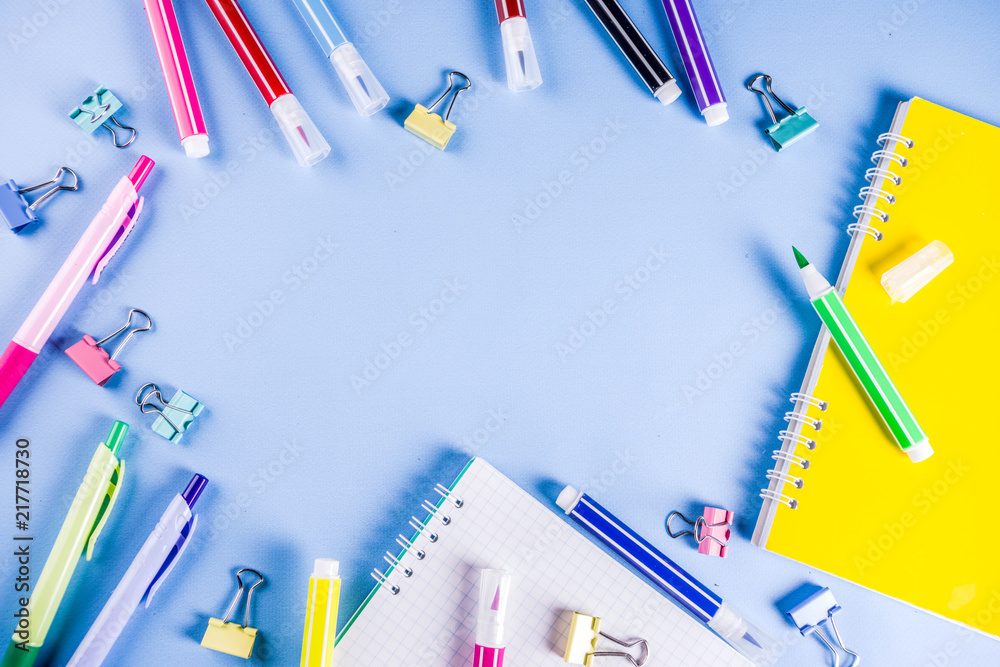 Back to school background, with bright accessories supplies for school and study - pen, pencils, markers, pencils, rulers, paperclips, sticks, notebooks, top view, free copy space for text