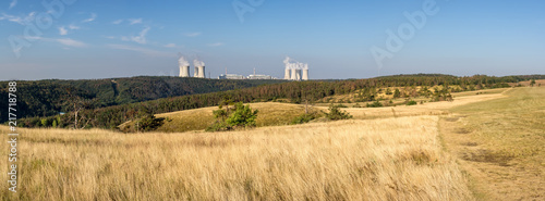 Summer landscape with meadow  forest and nuclear power plant