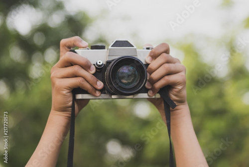 Hand and camera and travel.Photography or traveler Concept.