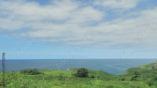 Landscape view of green hills and ocean blue water at Nothern Spain photo