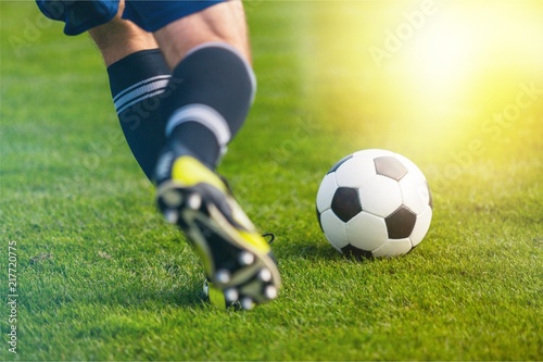 Fototapeta Naklejka Na Ścianę i Meble -  Running soccer player on grass