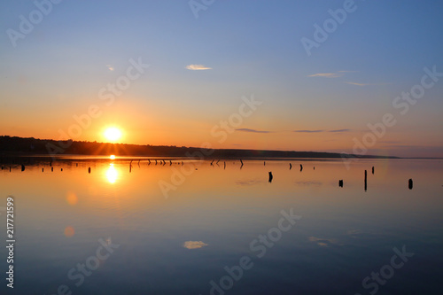 Sunset over the edge of the estuary.