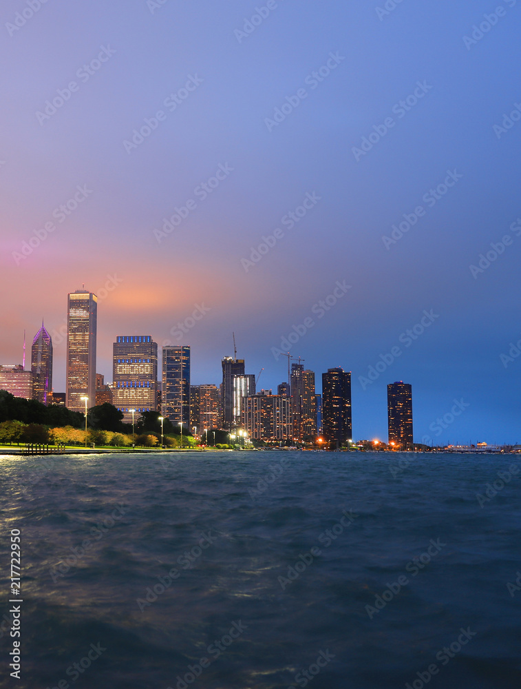 Chicago, Illinois, USA - June 22, 2018 - The Chicago skyline at night after a storm across Lake Michigan.