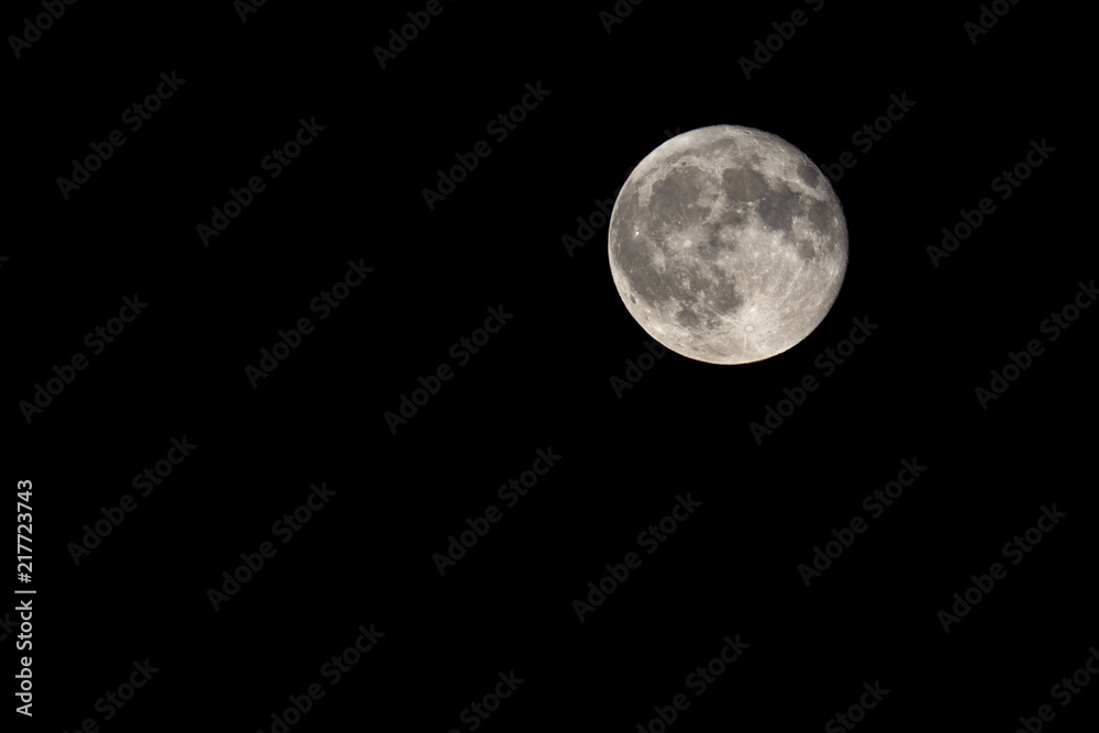 Naklejka premium Full moon on a clear sky in Caceres, Spain