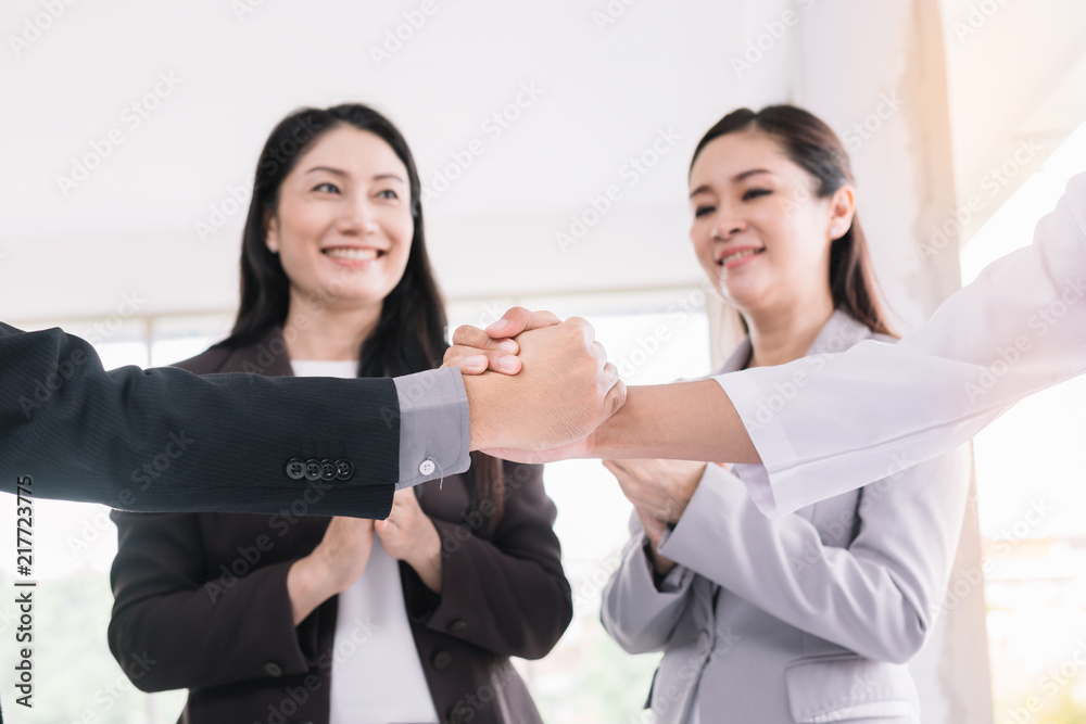 Businessmen confidently holding hands after successful meetings.He is making an agreement with his partner,Close-up of two businesspeople shaking hands while at work. Businessmen confidently holding hands after successful meetings.He is making an agreement with his partner,Close-up of two businesspeople shaking hands while at work.