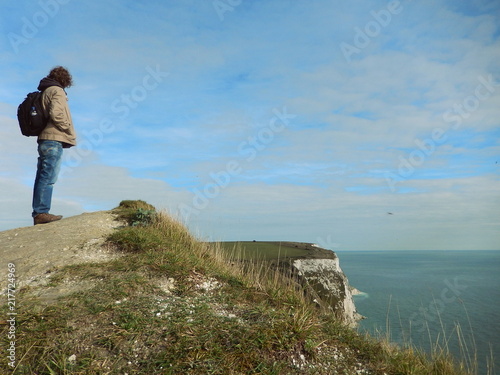 man alone looking beyond the horizon