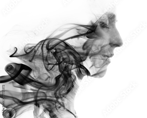 Canvas Print Double exposure portrait of a young woman and a smoky texture dissolving into he