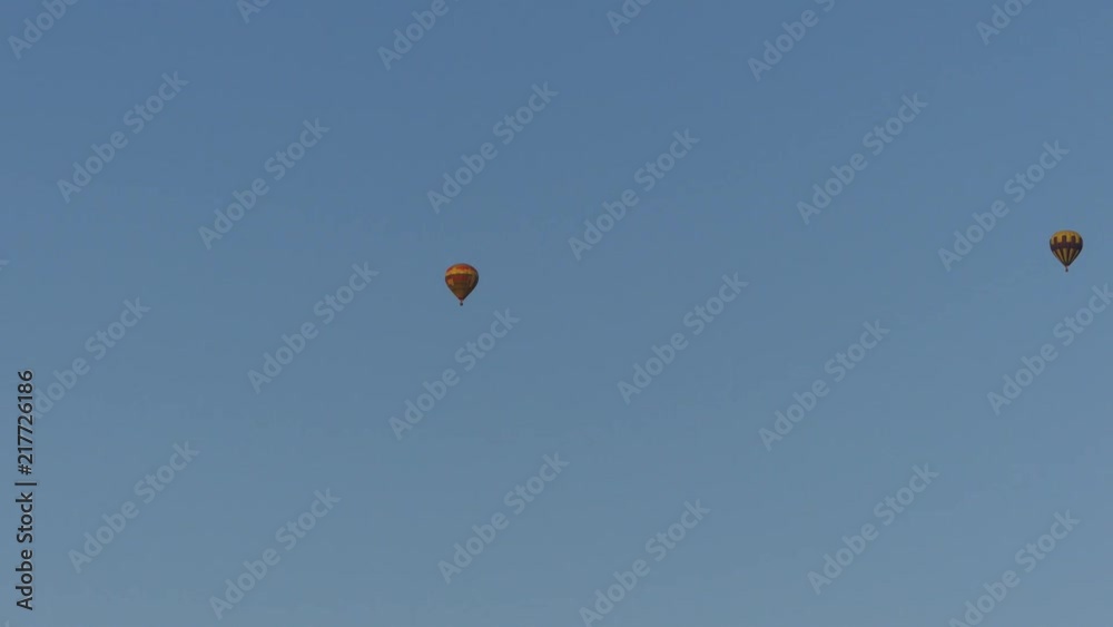 People ride in the air balloons. Balloons with tourists are cast in the sky.