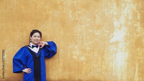 A Charming Asian Girl / Lady in The Blue, Chinese Style Academic Dress or Graduation Gown in A Public Park of CHINA. © JoeJirang