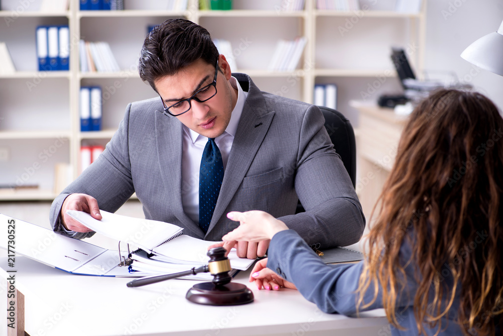 Lawyer discussing legal case with client Lawyer discussing legal case with client
