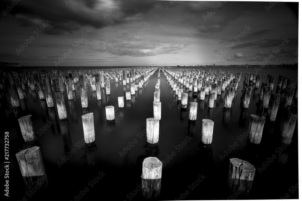 Old Pier and Buildings in Melbourne, Black and White Long Exposure