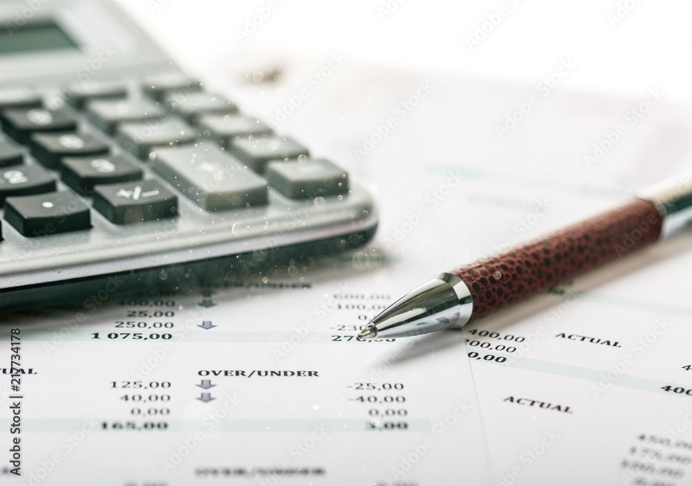 Calculator, pan and the financial report Calculator, pan and the financial report