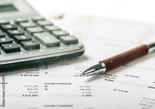 Calculator, pan and the financial report