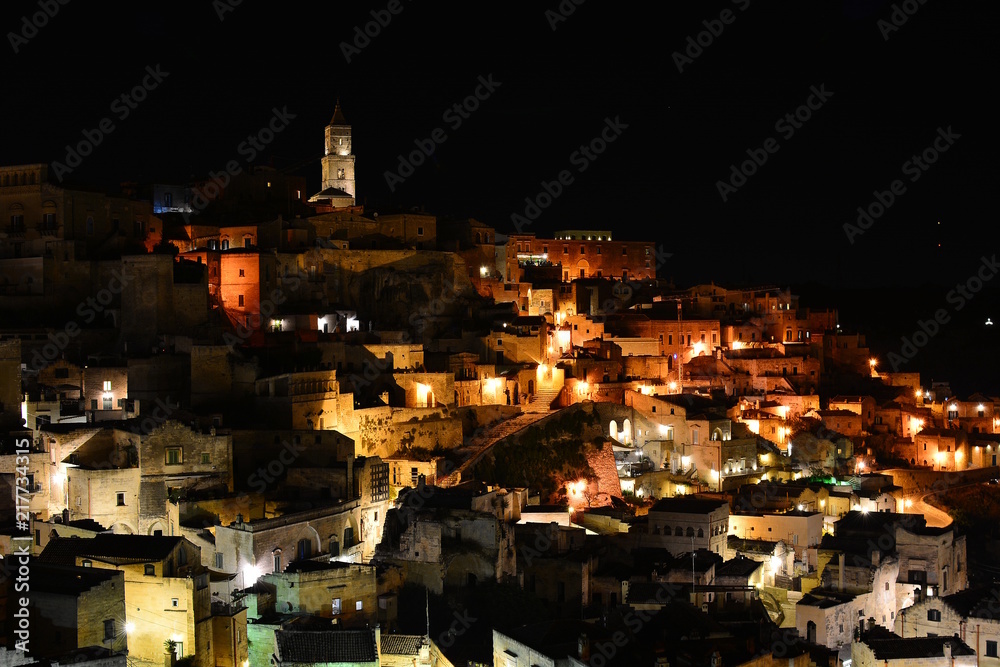 Panoramic view of ancient town of Matera (Sassi di Matera) by night. Basilicata, Italy.