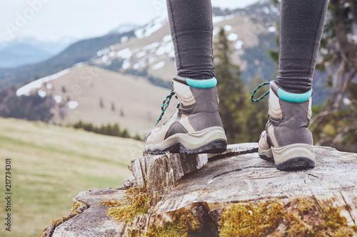 Hiking boots on stump