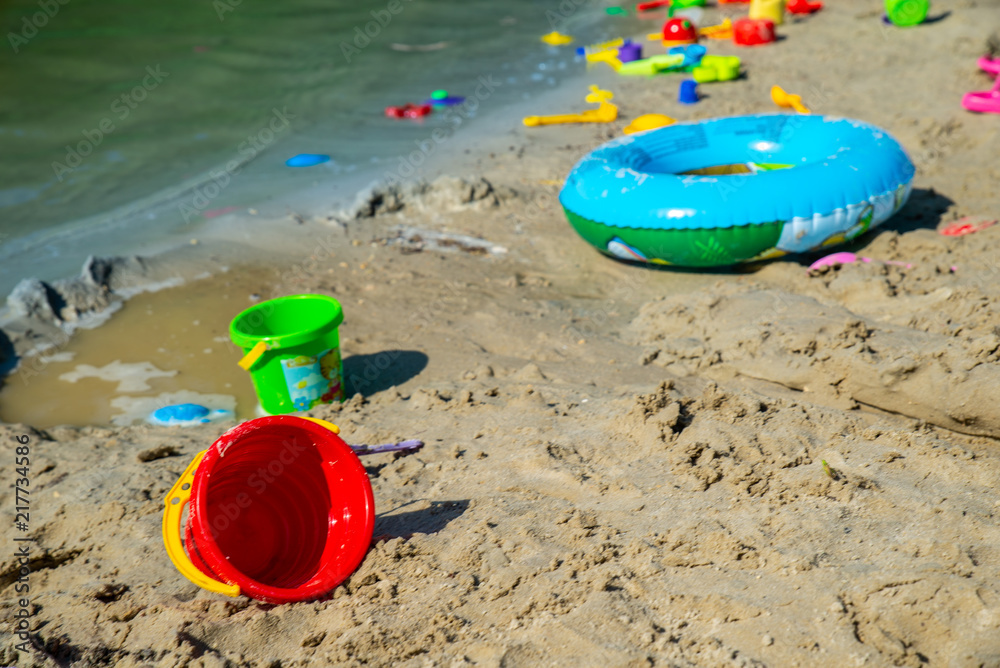 inflatable ring kids toys at sand beach close up. nobody inflatable ring kids toys at sand beach close up. nobody