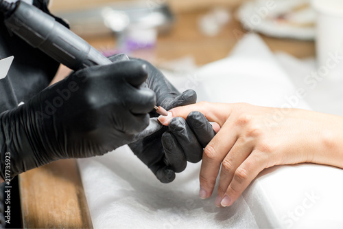 The process of manicure in a beauty salon, close-up.